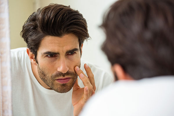 Man looking in mirror 